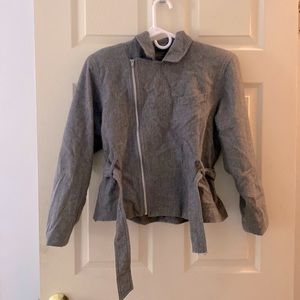 A gray blazer jacket with a zipper